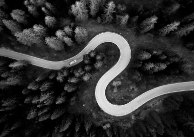 Aerial image of winding road in a forest